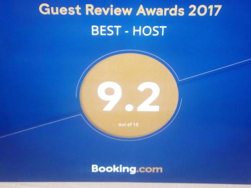 a sign that reads quickest review awards best host at Best Host in Sighnaghi
