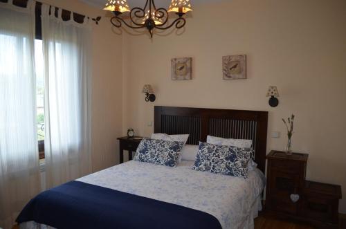 Cama o camas de una habitación en Apartamentos Turísticos Carrero