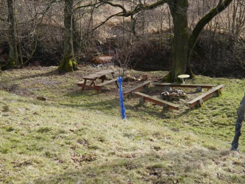 a picnic table and bench in a field at Pod kasztanem gospodarstwo agroturystyczne in Stronie Śląskie