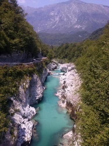 a view of a river in the mountains at Apartments Hlapi with SPA in Kobarid