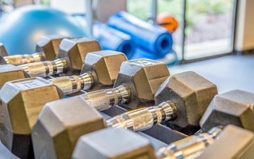 a pile of dumbbells on a table with a toy car at Hotel 116, A Coast Hotel Bellevue in Bellevue