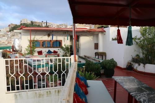 a balcony of a house with a swimming pool at Dar Zerhoune in Moulay Idriss Zerhoun