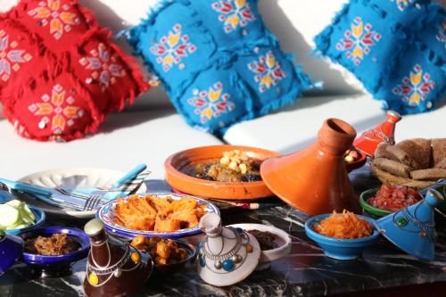 a table topped with dishes of food on a table at Dar Zerhoune in Moulay Idriss Zerhoun