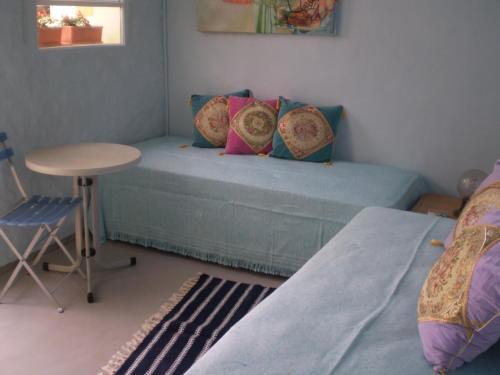 a room with a couch and a table and a table at Palermo Viejo Bed & Breakfast in Buenos Aires