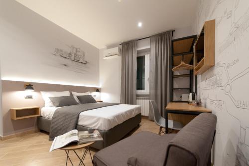 Ένα ή περισσότερα κρεβάτια σε δωμάτιο στο Eco di Napoli