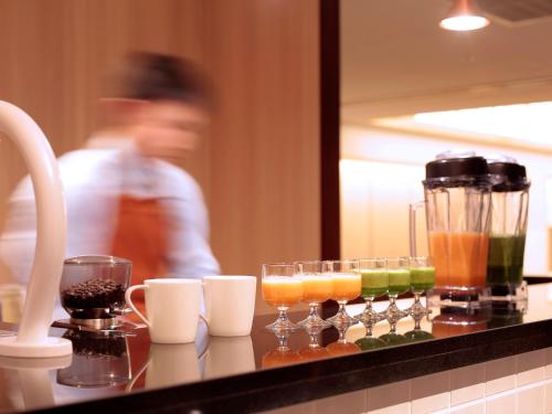 a counter with a bunch of drinks on it at Hotel Intergate Kyoto Shijo Shinmachi in Kyoto