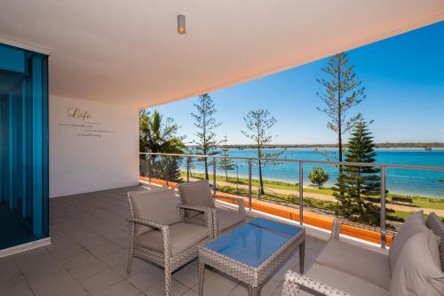 a balcony with a view of the water at Silvershore Apartments on the Broadwater in Gold Coast