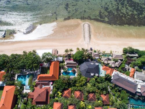 an aerial view of a resort and a beach at Puri Santrian Beach Resort And Spa in Sanur