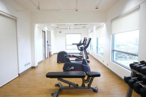 a gym with three elliptical machines in a row at TRYP by Wyndham Mall of Asia Manila in Manila