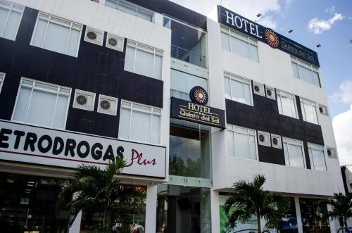 a building with a sign for a hotel at Hotel Quinta del Sol in Arauca