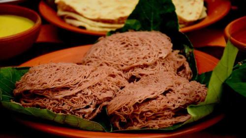 a sandwich on a plate on a table at Rosa Shashi Cabanas in Galle