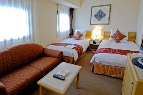 Postel nebo postele na pokoji v ubytování Hotel The Centre Utsunomiya