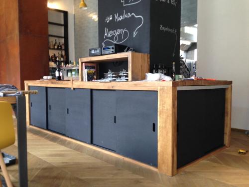 a bar in a room with a counter at Hotel city.city in Ostrava
