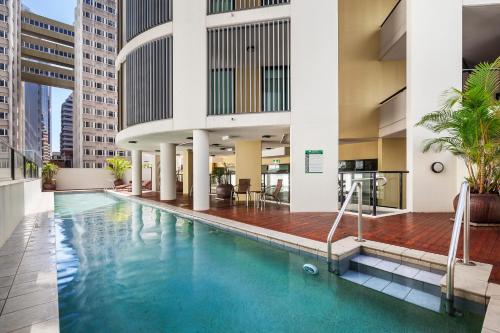 a swimming pool in the middle of a building at Quest River Park Central in Brisbane