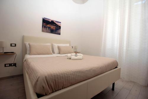 Una cama o camas en una habitación de Affittacamere Nonno Ninì