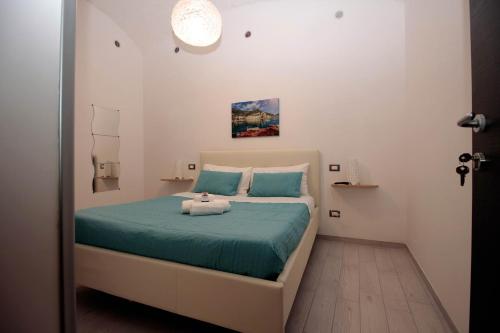 Una cama o camas en una habitación de Affittacamere Nonno Ninì