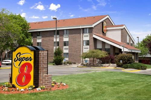 a super sign in front of a hotel at Super 8 by Wyndham Westminster Denver North in Westminster
