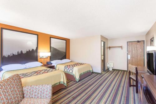 a hotel room with two beds and a tv at Super 8 by Wyndham Norton VA in Norton