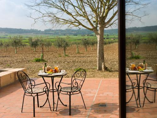 a table and chairs sitting on a patio at Agroturisme Gossalba in Sant Joan