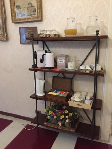 a shelf with items on it in a room at La Residenza dei Nobili in Catanzaro
