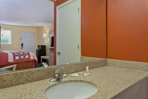 a bathroom with a sink in a hotel room at Super 8 by Wyndham Chipley in Chipley