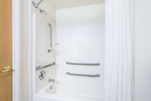 a bathroom with a shower and a sink at Super 8 by Wyndham West Middlesex/Sharon Area in West Middlesex
