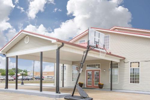 a basketball hoop in front of a building at Super 8 by Wyndham Talladega AL in Talladega