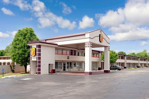 an empty parking lot in front of a hotel at Super 8 by Wyndham Oklahoma/Frontier City in Edmond