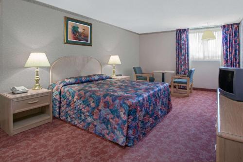 Postel nebo postele na pokoji v ubytování Empire Inn