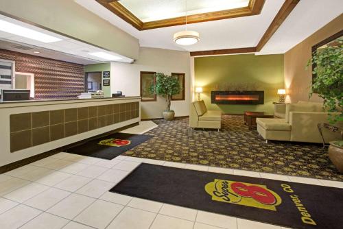a lobby of a hospital with chairs and a waiting room at Super 8 by Wyndham Wheat Ridge/Denver West in Wheat Ridge
