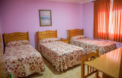 Postel nebo postele na pokoji v ubytování La Posada De Sancho