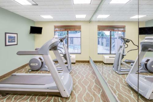 a gym with two treadmills and two ellipticals at Wingate by Wyndham Bossier City in Bossier City