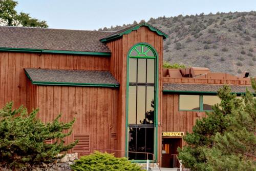 a large wooden building with a large window at Topaz Lodge in Gardnerville