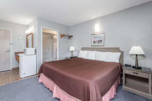 Ένα ή περισσότερα κρεβάτια σε δωμάτιο στο London Travel Inn