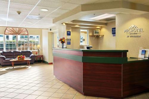 a lobby of a m hospital with a reception counter at Microtel Inn & Suites by Wyndham Rock Hill/Charlotte Area in Rock Hill