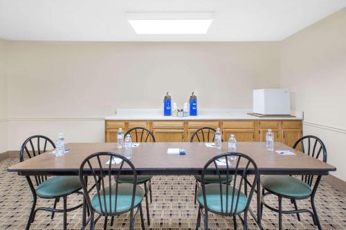 a conference room with a table and chairs at Microtel Inn & Suites by Wyndham Franklin in Franklin
