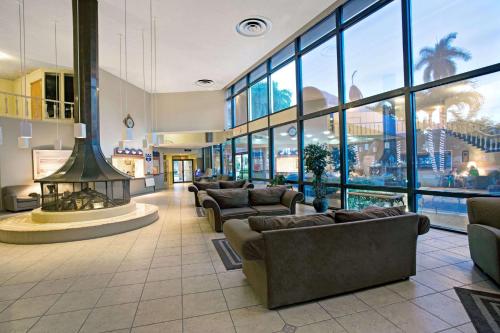 a lobby with couches and a fireplace in a building at Knights Inn Hallandale in Hollywood