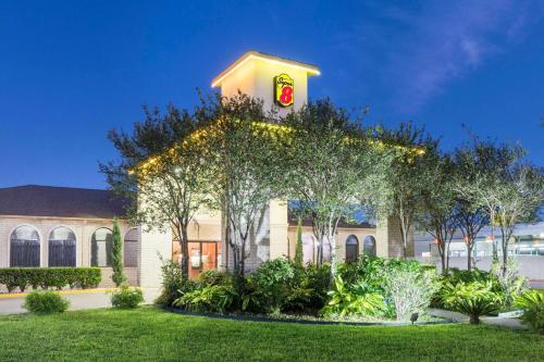 a building with a christmas wreath on top of it at Super 8 by Wyndham San Antonio at I-10 in San Antonio