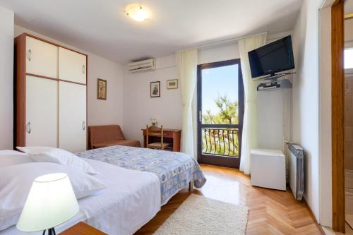 Postel nebo postele na pokoji v ubytování Rooms Marinac