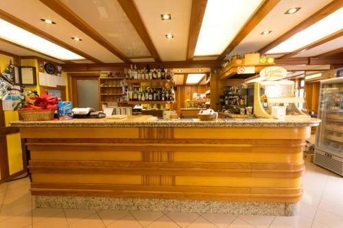 a bar in a restaurant with a counter at Hotel Punta Cian in Valtournenche