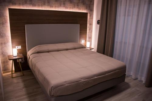 Letto o letti in una camera di 8room Hotel