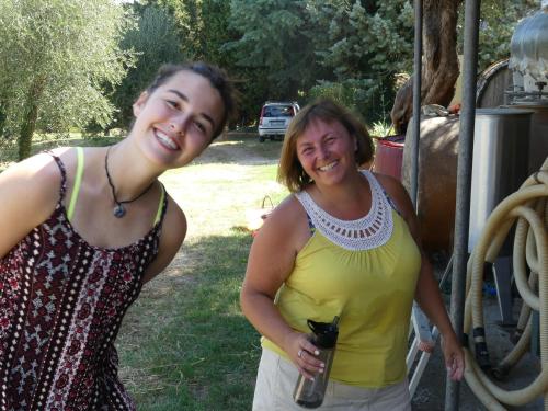 two women are standing next to each other at Due Piani in Barberino di Val dʼElsa