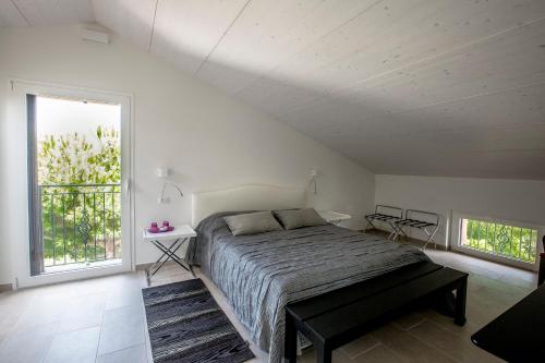 Postel nebo postele na pokoji v ubytování B&B - Uva Residence