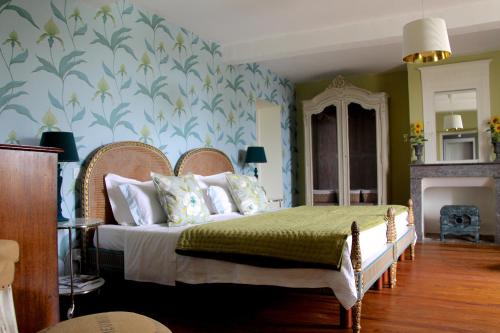Voodi või voodid majutusasutuse Vintage Vert toas