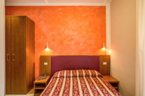 Een bed of bedden in een kamer bij Buonarroti Suite