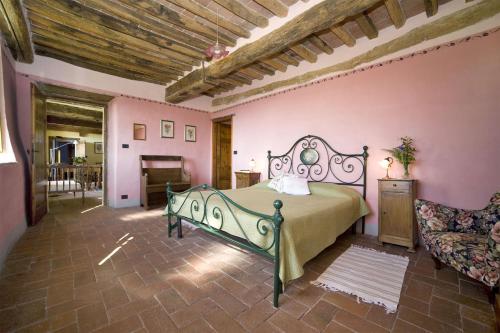 a bedroom with a bed and a couch in a room at Giannello in Capannori
