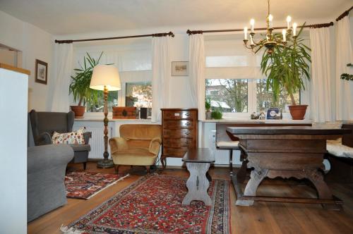 a living room with a piano and a couch at Apartment Ischl Home in Bad Ischl