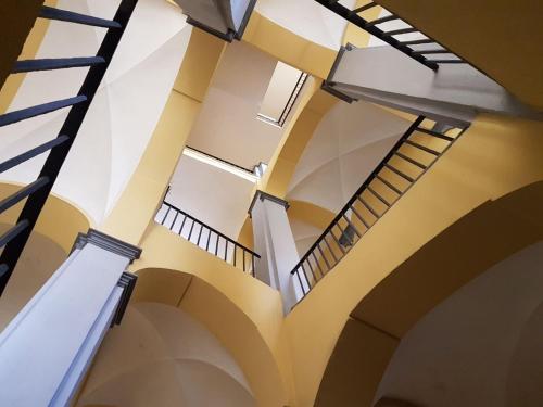 a view of the ceilings of a building with stairs at Casa Parthenope in San Giorgio a Cremano