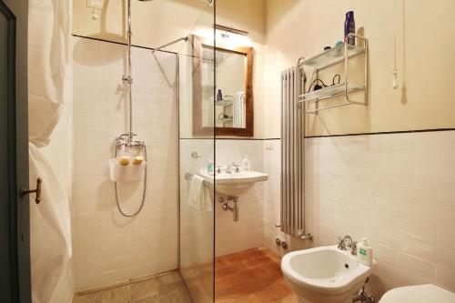 a bathroom with a shower and a toilet and a sink at Villa Trenta Prestigious Villa Enchanting Garden in Lucca