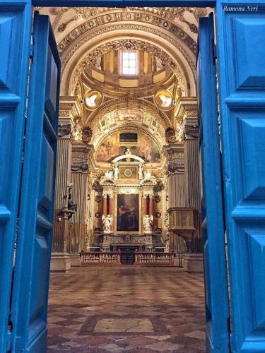 an open door to a large room with a building at IL NIDO DELLA FORTUNA oasi di pace, relax, storia e mare in Fano